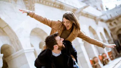 Walk of the pretty loving couple happily walking and having fun in Budapest, Hungary