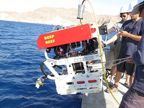 Gripper Robot on the side of a boat